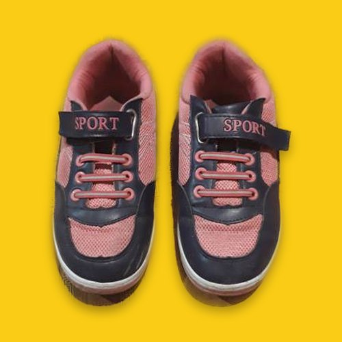 Pink sneakers on a bright yellow background